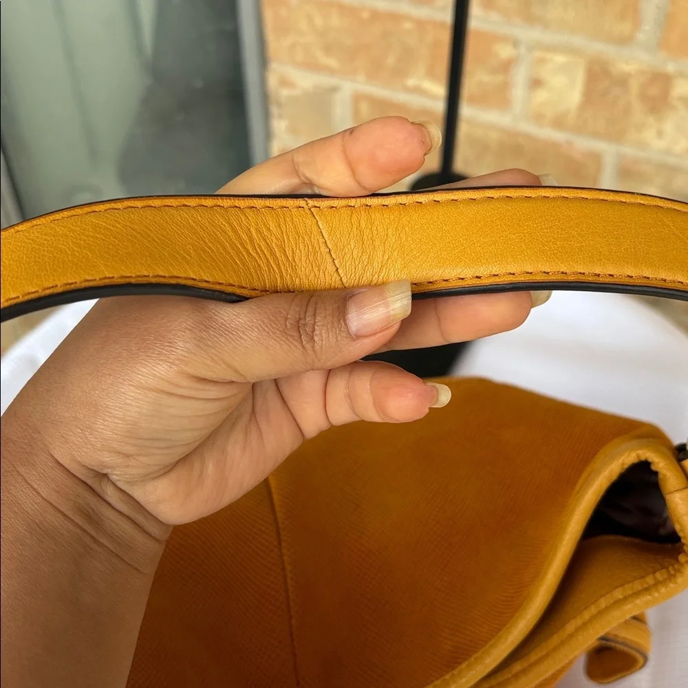 B. Makowsky Orange Hobo Bag